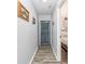 Hallway features wood-look flooring and neutral wall paint at 4350 Intercoastal Dr. # 1404, Little River, SC 29566
