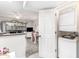 View from the kitchen to a laundry room and the living room beyond at 4350 Intercoastal Dr. # 1404, Little River, SC 29566