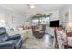Cozy living room featuring a daybed, recliner, and access to a screened-in balcony at 4350 Intercoastal Dr. # 1404, Little River, SC 29566