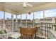Relaxing screened patio with comfortable seating, ceiling fan, and serene outdoor views at 4350 Intercoastal Dr. # 1404, Little River, SC 29566