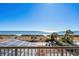 Ocean view from the balcony overlooking beach access, seating and dining areas at 4719 S Ocean Blvd. # 209, North Myrtle Beach, SC 29582
