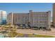 An exterior shot showcases a condo with parking, a pool, and beach access for convenient coastal living at 4719 S Ocean Blvd. # 209, North Myrtle Beach, SC 29582
