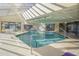 Stunning indoor pool with skylights and lounge area, perfect for year-round enjoyment at 4719 S Ocean Blvd. # 209, North Myrtle Beach, SC 29582