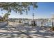 Scenic waterfront view with boats docked, streetlamps, and palm trees creating a serene atmosphere at 4719 S Ocean Blvd. # 209, North Myrtle Beach, SC 29582