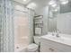 Well-maintained bathroom featuring a shower, toilet, sink, vanity, and decorative shelves at 4803 Bovardia Pl. # 102, Myrtle Beach, SC 29577
