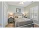 Cozy bedroom with a comfortable bed, bedside tables, lamps, and window with shutters at 4803 Bovardia Pl. # 102, Myrtle Beach, SC 29577
