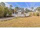 Fenced community pool area, landscaped with mature trees and shrubs at 4803 Bovardia Pl. # 102, Myrtle Beach, SC 29577