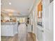 Inviting entryway showcasing modern wood floors, white trim, and convenient storage options near the kitchen and main living areas at 4803 Bovardia Pl. # 102, Myrtle Beach, SC 29577