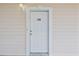 Exterior of a front door with white trim at 4803 Bovardia Pl. # 102, Myrtle Beach, SC 29577