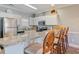 Well-lit kitchen with stainless steel appliances, granite countertops, breakfast bar, and plenty of cabinet space at 4803 Bovardia Pl. # 102, Myrtle Beach, SC 29577