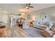 Spacious living room and dining area with decorative accents and wood floors at 4803 Bovardia Pl. # 102, Myrtle Beach, SC 29577