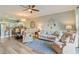 Spacious living room and dining area with decorative accents and wood floors at 4803 Bovardia Pl. # 102, Myrtle Beach, SC 29577