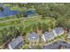 Scenic aerial view overlooking the condos and the lush green golf course and pond at 4940 Windsor Green Way # 203, Myrtle Beach, SC 29579