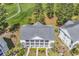 Overhead view of condo building with gray roof, multiple balconies, and manicured landscaping at 4940 Windsor Green Way # 203, Myrtle Beach, SC 29579