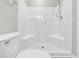 Bright bathroom features a white shower and commode, and chrome hardware at 4940 Windsor Green Way # 203, Myrtle Beach, SC 29579