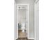 Bright half bathroom showing commode, small vanity, mirror, and towel rack with neutral paint and flooring at 4940 Windsor Green Way # 203, Myrtle Beach, SC 29579