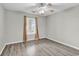 Simple bedroom with wood-look floors, a ceiling fan, and one window at 4940 Windsor Green Way # 203, Myrtle Beach, SC 29579