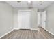 Empty bedroom features wood-look floors, closet and access to the hallway at 4940 Windsor Green Way # 203, Myrtle Beach, SC 29579