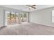 Bright bedroom with access to a private balcony overlooking the wooded property at 4940 Windsor Green Way # 203, Myrtle Beach, SC 29579