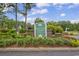 Windsor Green at WaterFord Plantation sign, with lush landscaping and brick pillars at 4940 Windsor Green Way # 203, Myrtle Beach, SC 29579