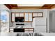 Efficient kitchen featuring wood trim, modern microwave, and essential appliances at 4940 Windsor Green Way # 203, Myrtle Beach, SC 29579