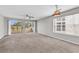Spacious living room filled with natural light, sliding door access to a private balcony at 4940 Windsor Green Way # 203, Myrtle Beach, SC 29579