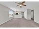 Spacious living room with an adjacent kitchen and ample natural light at 4940 Windsor Green Way # 203, Myrtle Beach, SC 29579