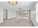 Bright living room with sliding glass doors leading to a balcony with golf course views at 4940 Windsor Green Way # 203, Myrtle Beach, SC 29579