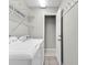 Practical mudroom with washer, dryer, shelving, and convenient hooks for easy storage at 4940 Windsor Green Way # 203, Myrtle Beach, SC 29579