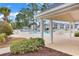 Relaxing poolside view from a covered patio, showcasing the pool and condo buildings at 4940 Windsor Green Way # 203, Myrtle Beach, SC 29579