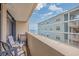 Relaxing balcony with seating, offering ocean views and a glimpse of nearby buildings at 501 S Ocean Blvd. # 307, North Myrtle Beach, SC 29582