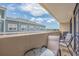Balcony view showcasing seating, nearby buildings, and sky at 501 S Ocean Blvd. # 307, North Myrtle Beach, SC 29582