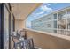 Inviting balcony with chairs, offering views of nearby buildings and the ocean at 501 S Ocean Blvd. # 307, North Myrtle Beach, SC 29582