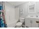 Well-lit bathroom with a combined tub and shower, plus a vanity with beach-themed decor at 501 S Ocean Blvd. # 307, North Myrtle Beach, SC 29582