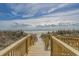 Enjoy easy access to the beach via a wooden walkway, surrounded by the serenity of nature and the ocean at 501 S Ocean Blvd. # 307, North Myrtle Beach, SC 29582