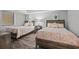 Comfortable bedroom with two twin beds, light walls, and coastal decor for a relaxing stay at 501 S Ocean Blvd. # 307, North Myrtle Beach, SC 29582