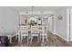 Bright dining space with wood table offers ample seating and views of the kitchen at 501 S Ocean Blvd. # 307, North Myrtle Beach, SC 29582