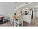 Cozy dining area adjacent to kitchen features wood table with seating for six at 501 S Ocean Blvd. # 307, North Myrtle Beach, SC 29582