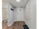 Welcoming unit entry with wood-look flooring, a coat rack and a convenient half bath nearby at 501 S Ocean Blvd. # 307, North Myrtle Beach, SC 29582