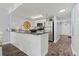 Modern kitchen features stainless steel appliances, granite counters, and an eat-in breakfast bar at 501 S Ocean Blvd. # 307, North Myrtle Beach, SC 29582