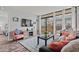 Comfortable living room featuring balcony access, wood-look flooring, and stylish decor at 501 S Ocean Blvd. # 307, North Myrtle Beach, SC 29582
