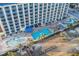 Aerial view of the condominium with pools, play area, boardwalk to beach and manicured grounds at 5200 N Ocean Blvd. # 937, Myrtle Beach, SC 29577