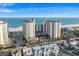 Expansive aerial view of a beachfront condo building with beautiful ocean views and surrounding neighborhood at 5200 N Ocean Blvd. # 937, Myrtle Beach, SC 29577