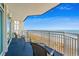 Inviting balcony with comfortable seating, offering stunning views of the ocean and sandy beach at 5200 N Ocean Blvd. # 937, Myrtle Beach, SC 29577