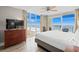 Bedroom featuring large windows, beach view, and classic furnishings for ultimate comfort at 5200 N Ocean Blvd. # 937, Myrtle Beach, SC 29577
