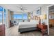 Bright, stylish bedroom showcasing a plush bed, ocean view balcony, and elegant decor at 5200 N Ocean Blvd. # 937, Myrtle Beach, SC 29577