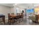 Open-concept living space with dining table, chairs, and a view of the living room and balcony beyond at 5200 N Ocean Blvd. # 937, Myrtle Beach, SC 29577