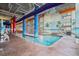 Indoor pool with colorful columns, floor-to-ceiling windows and beach themed murals at 5200 N Ocean Blvd. # 937, Myrtle Beach, SC 29577