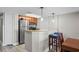 A modern kitchen with stainless steel appliances, granite countertops, and a breakfast bar area with seating at 5200 N Ocean Blvd. # 937, Myrtle Beach, SC 29577
