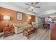 Comfortable living room with wood flooring, a sofa, armchair and a view into the kitchen and dining area at 5200 N Ocean Blvd. # 937, Myrtle Beach, SC 29577